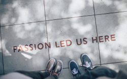 'passion led us here' on sidewalk